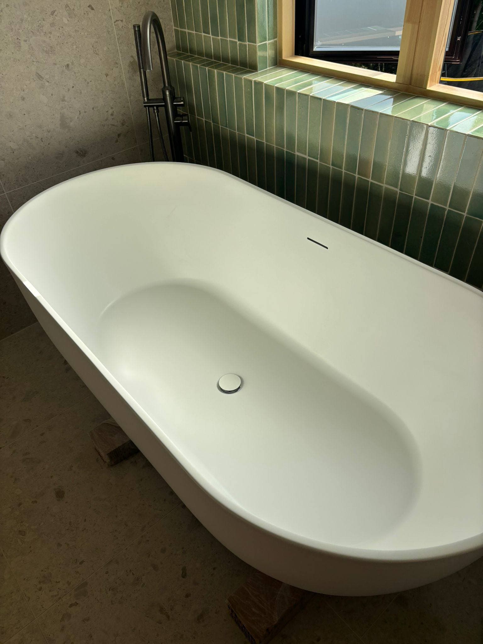 The same freestanding bath cleaned and polished, ready for handover