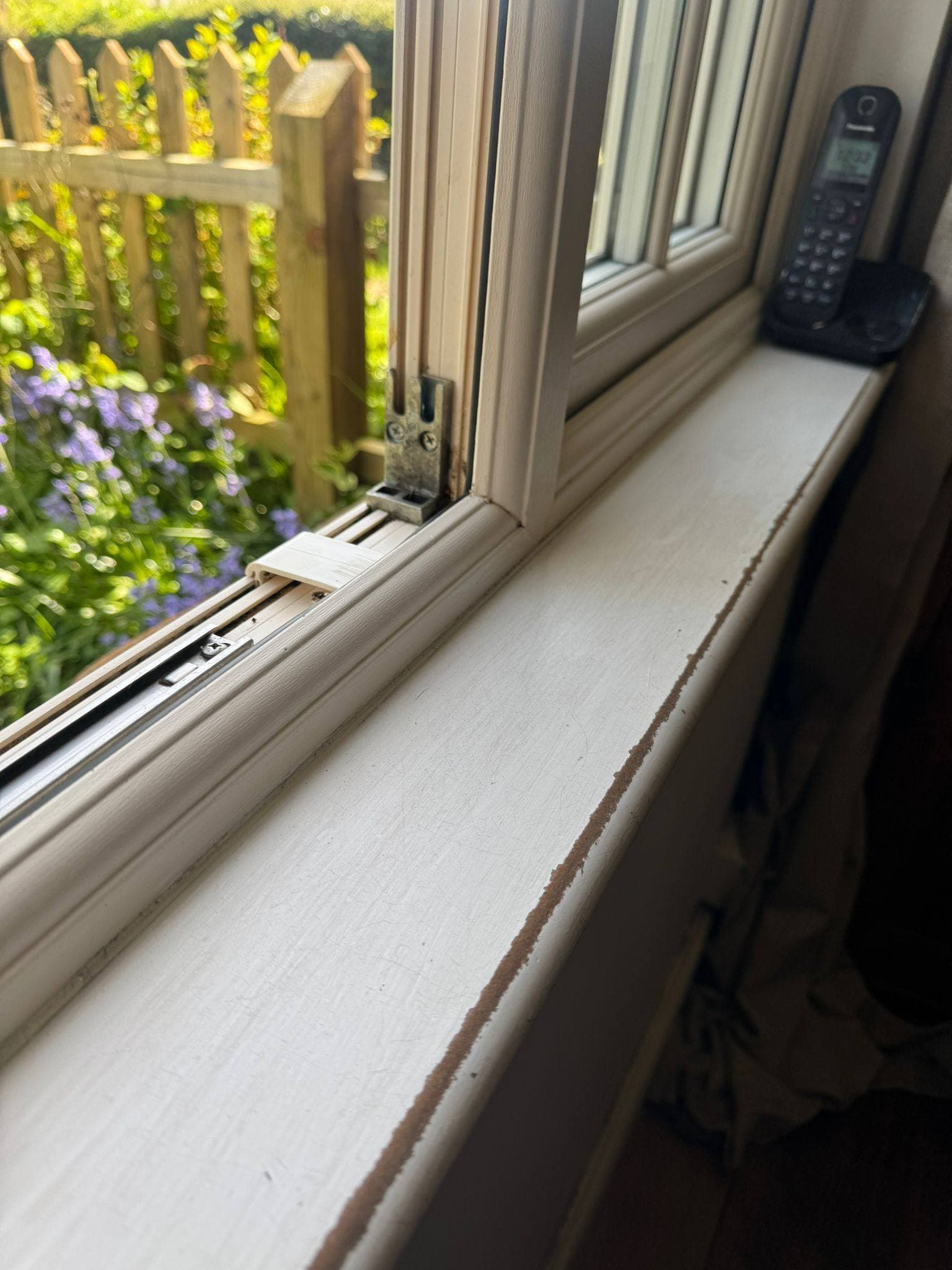 The same window sill wiped down and detailed back to a clean white finish