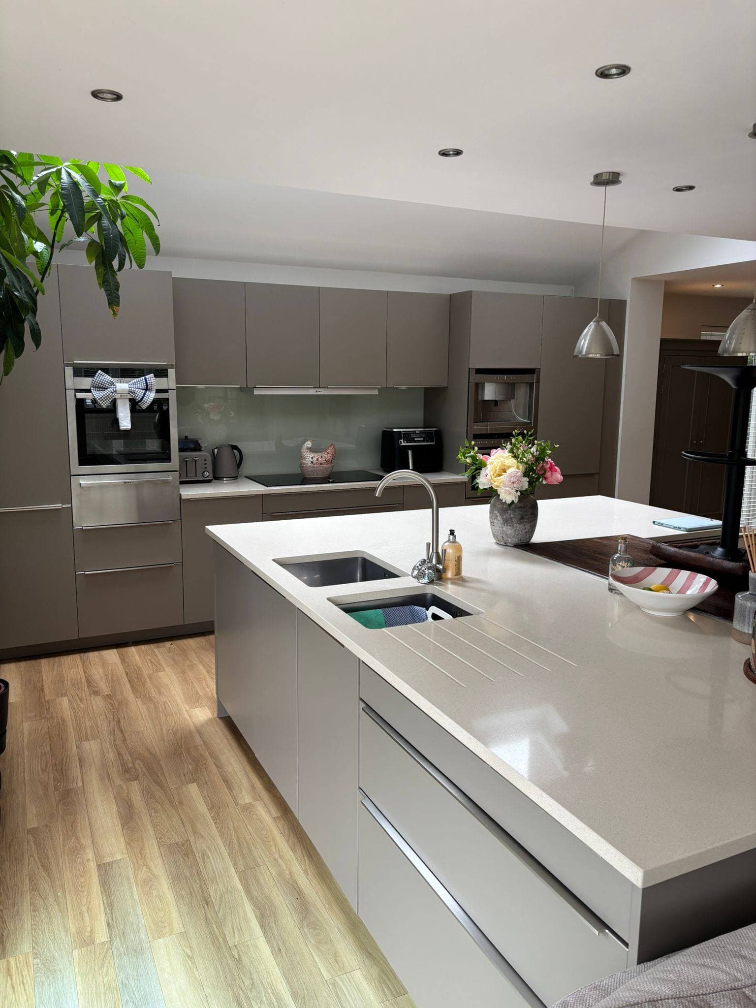 A modern grey kitchen cleaned to a sparkling finish